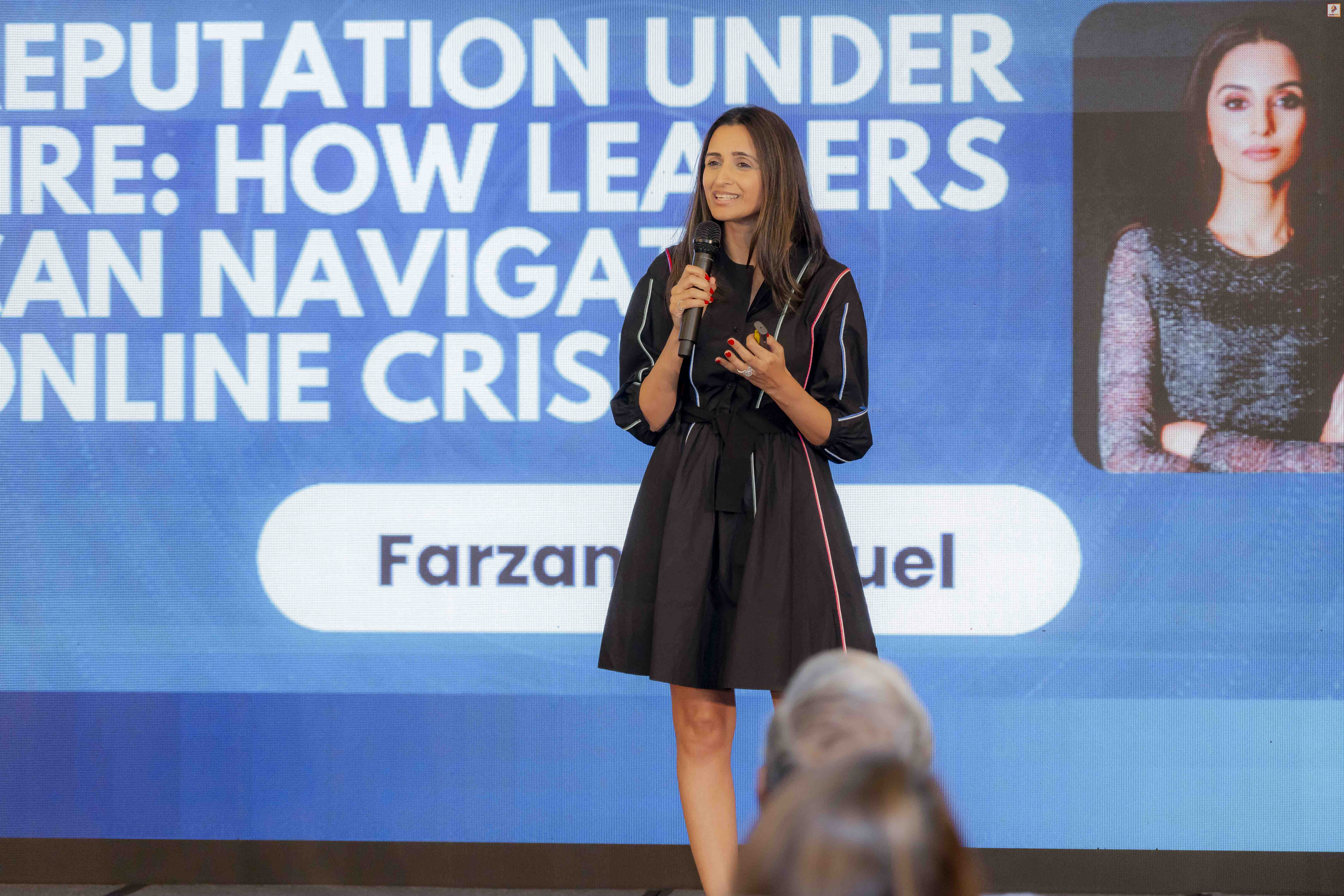 Farzana Baduel speaking on stage